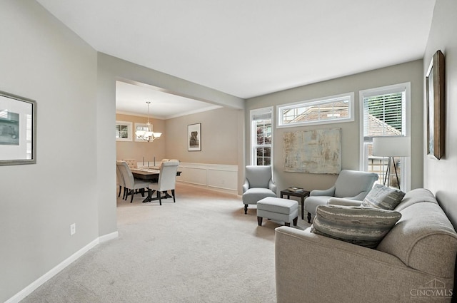 10285 Plantation Pointe Dr, Symmes Twp, OH 45140 - carpeted living room featuring a chandelier and a wainscoted wall