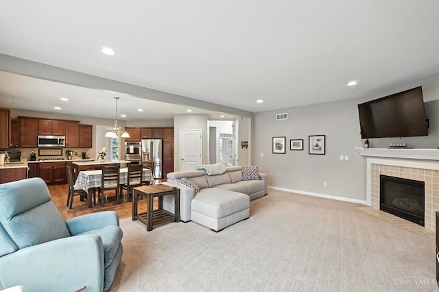 10285 Plantation Pointe Dr, Symmes Twp, OH 45140 - living area featuring recessed lighting, a tile fireplace, and light colored carpet