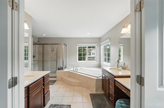 10285 Plantation Pointe Dr, Symmes Twp, OH 45140 - full bathroom with two vanities, tile patterned flooring, a bath, and a stall shower