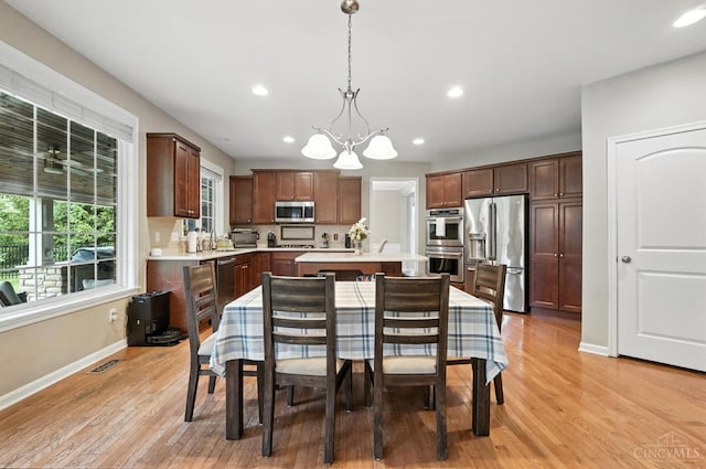 10285 Plantation Pointe Dr, Symmes Twp, OH 45140 - kitchen with stainless steel appliances, a chandelier, light countertops, a kitchen island with sink, and recessed lighting