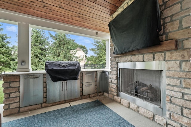 10285 Plantation Pointe Dr, Symmes Twp, OH 45140 - view of patio with an outdoor kitchen and an outdoor stone fireplace