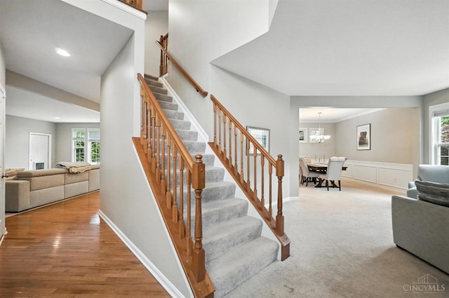 10285 Plantation Pointe Dr, Symmes Twp, OH 45140 - stairs with recessed lighting, a chandelier, and wood finished floors