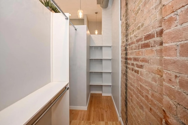 1201 Vine St Unit C, Cincinnati, OH 45202 - corridor featuring brick wall and light wood-type flooring