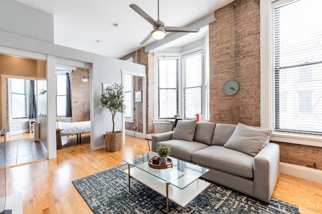 1201 Vine St Unit C, Cincinnati, OH 45202 - living area with plenty of natural light, brick wall, ceiling fan, and light wood-style floors
