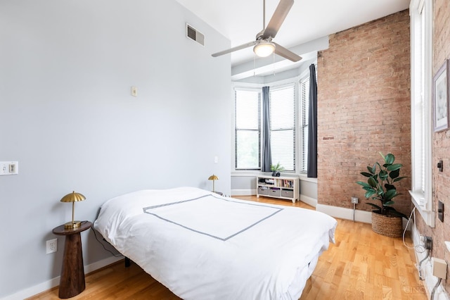 1201 Vine St Unit C, Cincinnati, OH 45202 - bedroom featuring light wood finished floors, brick wall, and ceiling fan