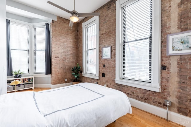 1201 Vine St Unit C, Cincinnati, OH 45202 - bedroom with brick wall and wood finished floors
