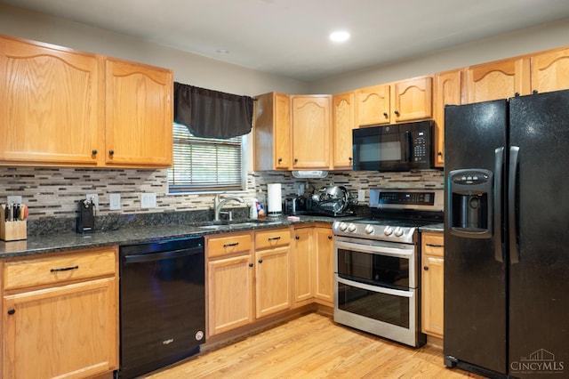 1662 W Kemper Rd, Springfield Twp, OH 45240 - kitchen with black appliances, light brown cabinetry, light wood-type flooring, tasteful backsplash, and dark stone countertops