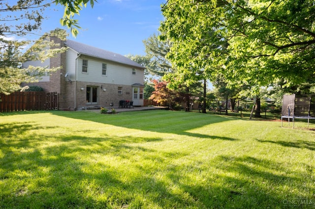 1662 W Kemper Rd, Springfield Twp, OH 45240 - view of yard with a trampoline and a patio area