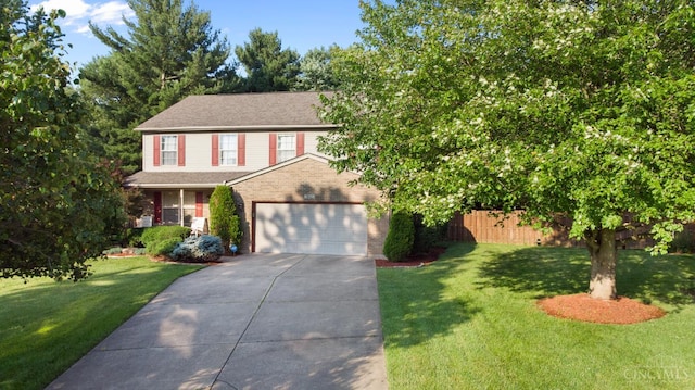 1662 W Kemper Rd, Springfield Twp, OH 45240 - view of front of home with driveway, an attached garage, brick siding, and roof with shingles
