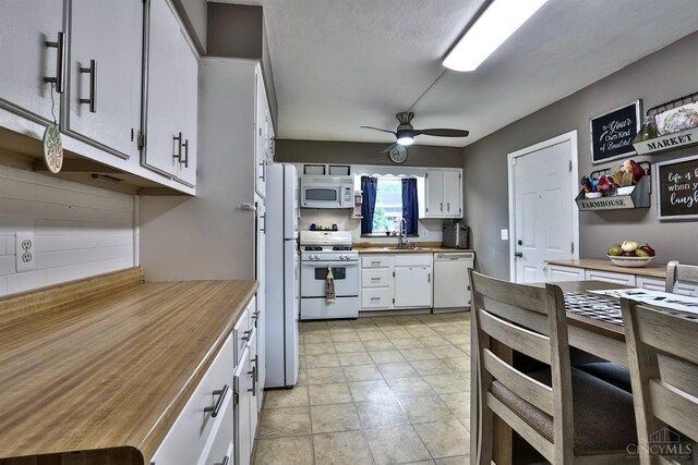 2872 Sheldon Ave, Cincinnati, OH 45239 - kitchen with white appliances, ceiling fan, white cabinetry, decorative backsplash, and wooden counters