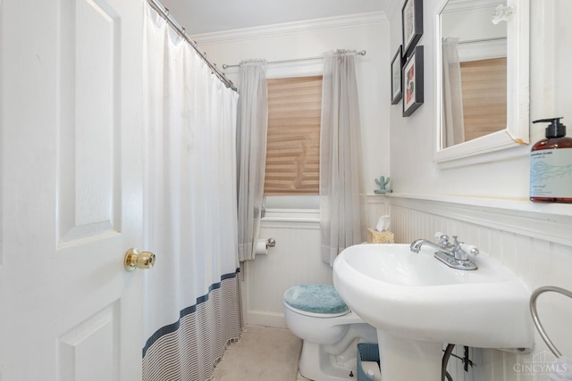 6579 Sherman Ave, Anderson Twp, OH 45230 - full bath with crown molding, a wainscoted wall, tile patterned floors, and a decorative wall