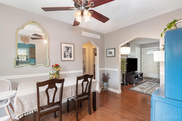 6579 Sherman Ave, Anderson Twp, OH 45230 - dining area with wood finished floors, a ceiling fan, and arched walkways