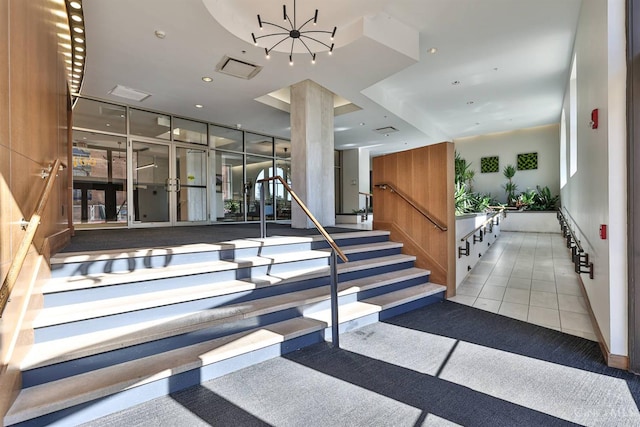 400 Pike St Unit 921, Cincinnati, OH 45202 - staircase featuring a chandelier and recessed lighting