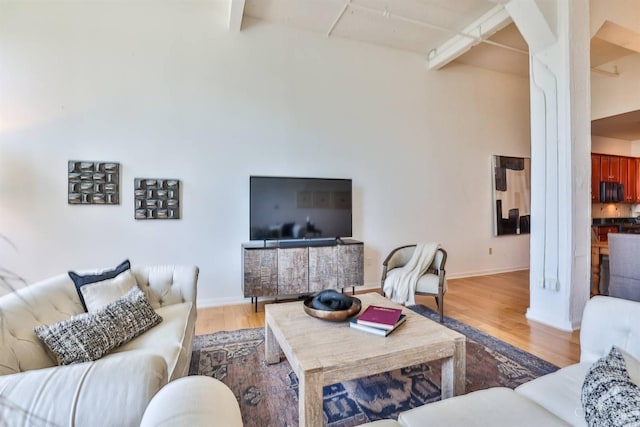400 Pike St Unit 921, Cincinnati, OH 45202 - living room featuring wood finished floors and beam ceiling