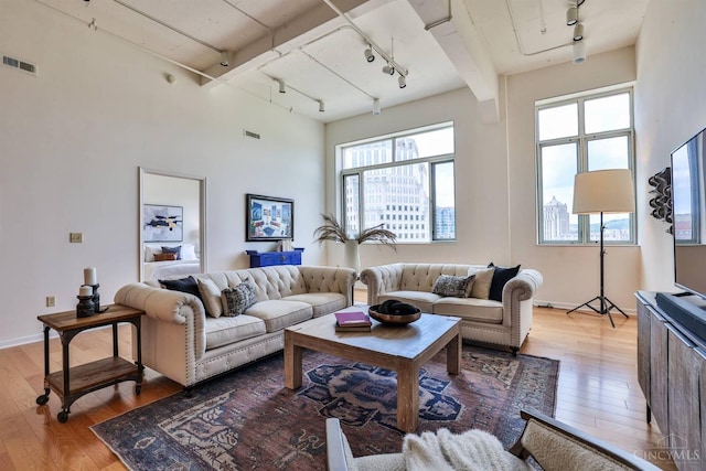 400 Pike St Unit 921, Cincinnati, OH 45202 - living room featuring track lighting and hardwood / wood-style floors