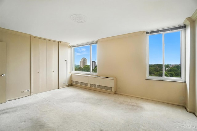 2401 Ingleside Ave Unit 8D, Cincinnati, OH 45206 - unfurnished bedroom with radiator and carpet