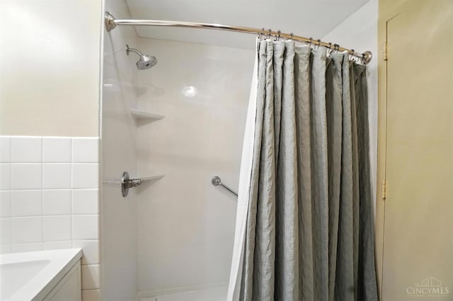 2401 Ingleside Ave Unit 8D, Cincinnati, OH 45206 - full bathroom with a shower stall, tile walls, and vanity