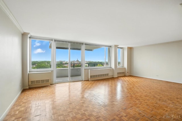 2401 Ingleside Ave Unit 8D, Cincinnati, OH 45206 - empty room with radiator, ornamental molding, and a wall of windows