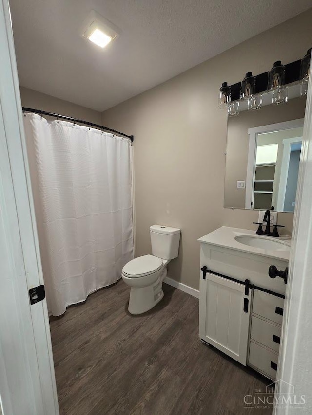 423 Howard St, Wilmington, OH 45177 - bathroom featuring wood finished floors and vanity