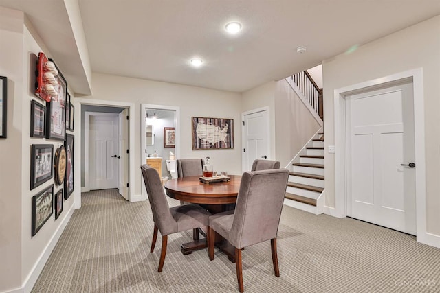1439 Legacy Ct, Troy, OH 45373 - dining area with light carpet, stairs, and recessed lighting