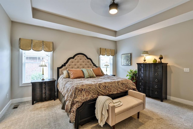 1439 Legacy Ct, Troy, OH 45373 - bedroom featuring light colored carpet, ceiling fan, and a tray ceiling