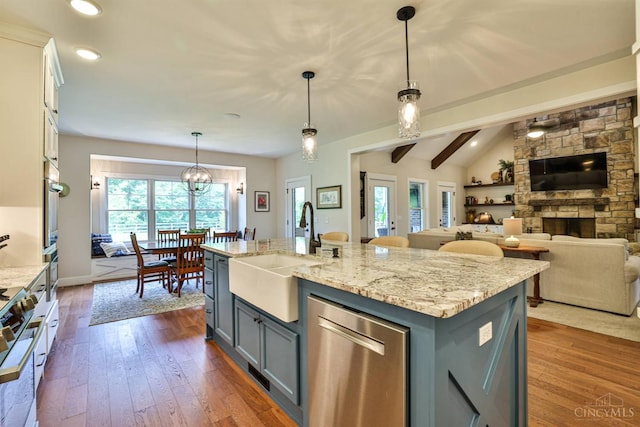 1439 Legacy Ct, Troy, OH 45373 - kitchen with appliances with stainless steel finishes, gray cabinets, light stone counters, open floor plan, and recessed lighting
