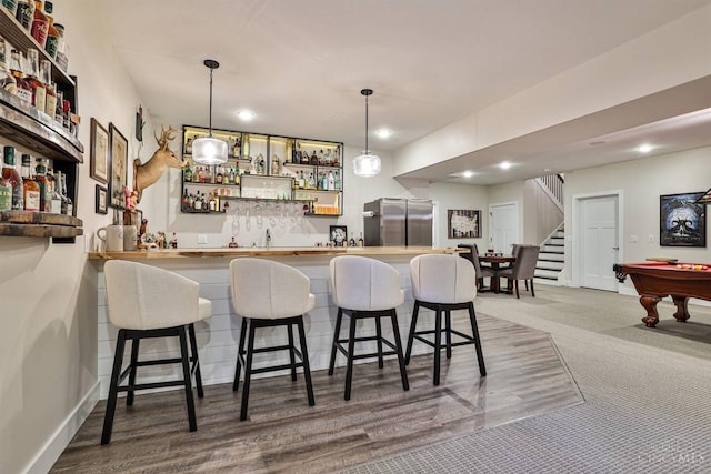 1439 Legacy Ct, Troy, OH 45373 - indoor wet bar with freestanding refrigerator, stairway, decorative light fixtures, billiards, and recessed lighting