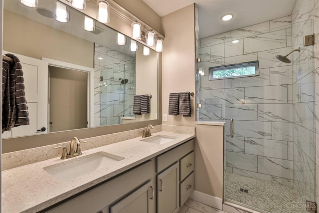 1439 Legacy Ct, Troy, OH 45373 - bathroom with marble finish flooring, a shower stall, double vanity, and recessed lighting