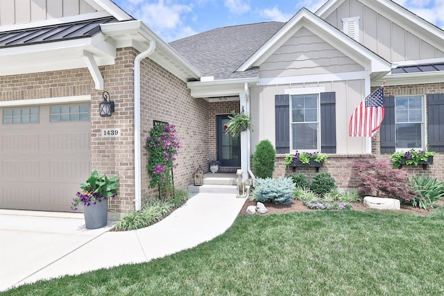 1439 Legacy Ct, Troy, OH 45373 - property entrance featuring brick siding, board and batten siding, a standing seam roof, and a garage