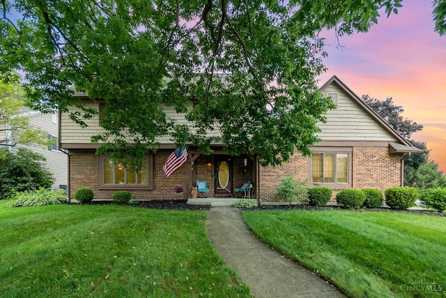 501 Tara Oaks Dr, Middletown, OH 45042 - view of front of house with a lawn and brick siding