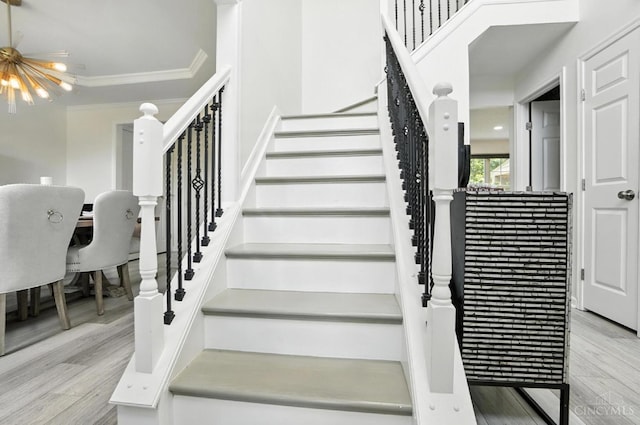4870 Highland Oaks Dr, Green Twp, OH 45248 - stairway with wood finished floors and crown molding