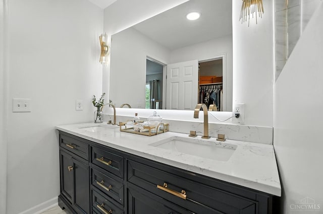 4870 Highland Oaks Dr, Green Twp, OH 45248 - bathroom featuring double vanity and a spacious closet