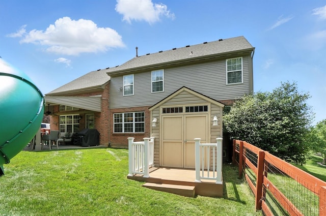 4870 Highland Oaks Dr, Green Twp, OH 45248 - rear view of property featuring a shed, a fenced backyard, a patio, and brick siding