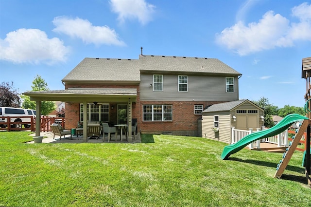 4870 Highland Oaks Dr, Green Twp, OH 45248 - back of house featuring a patio area, a playground, a shed, and brick siding