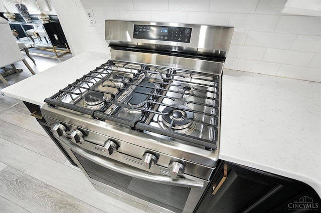 4870 Highland Oaks Dr, Green Twp, OH 45248 - kitchen view of stainless steel gas stove and backsplash