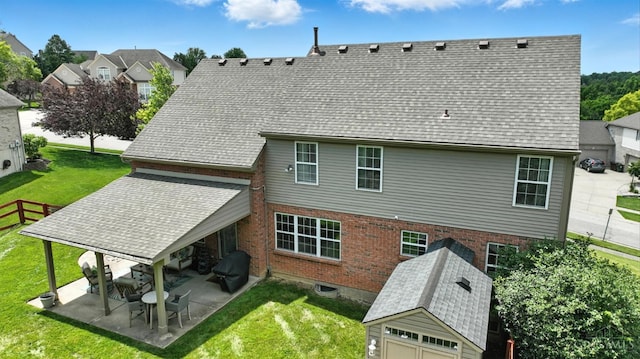 4870 Highland Oaks Dr, Green Twp, OH 45248 - rear view of house featuring a patio area, brick siding, and an outdoor structure
