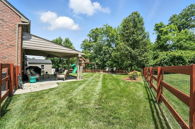 4870 Highland Oaks Dr, Green Twp, OH 45248 - fenced backyard with a playground, a patio, and a ceiling fan