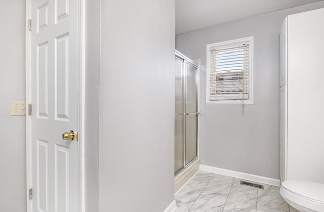 197 Millville, Hamilton, OH 45013 - bathroom featuring marble finish floors and a shower with shower door