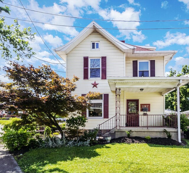197 Millville, Hamilton, OH 45013 - view of front facade with a porch and a front lawn