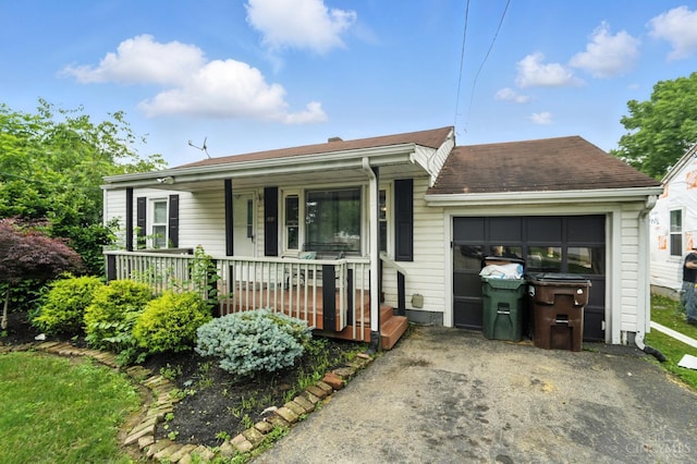 668 Shawhan Rd, Union Twp, OH 45065 - single story home featuring asphalt driveway, a porch, and a garage