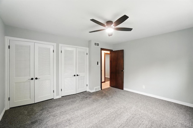 2000 Neeb Rd, Green Twp, OH 45233 - unfurnished bedroom featuring multiple closets, carpet flooring, and a ceiling fan