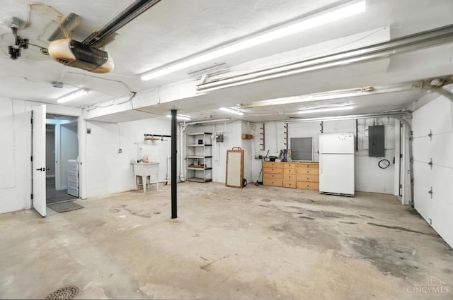 2000 Neeb Rd, Green Twp, OH 45233 - garage with freestanding refrigerator, a garage door opener, and electric panel