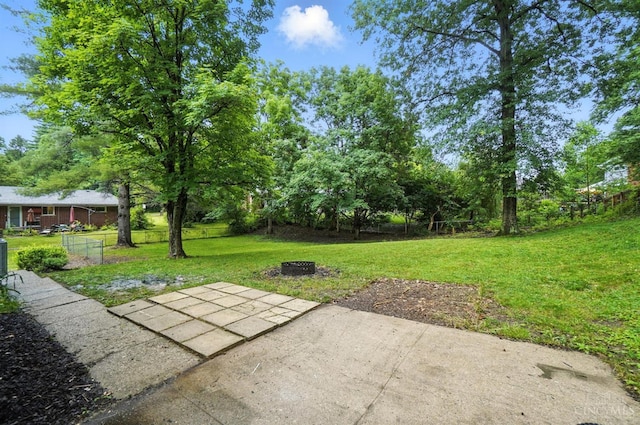 2000 Neeb Rd, Green Twp, OH 45233 - view of green lawn with a patio and a fire pit