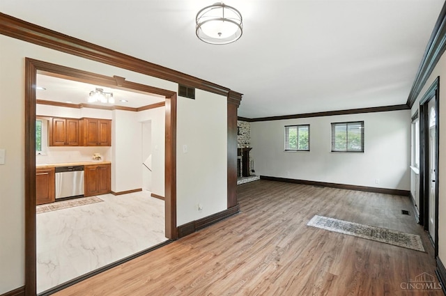 2000 Neeb Rd, Green Twp, OH 45233 - unfurnished living room with ornamental molding, light wood-style flooring, and a fireplace