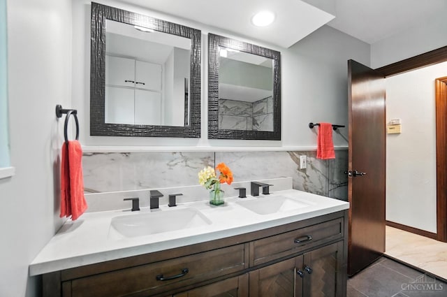 2000 Neeb Rd, Green Twp, OH 45233 - full bath with double vanity, decorative backsplash, and tile patterned flooring