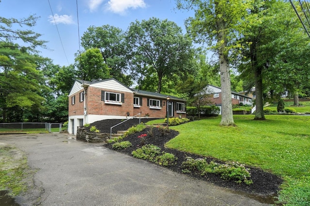 2000 Neeb Rd, Green Twp, OH 45233 - ranch-style house featuring a garage, brick siding, and asphalt driveway