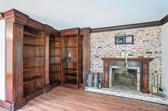 2000 Neeb Rd, Green Twp, OH 45233 - unfurnished living room with a fireplace, wood finished floors, and crown molding