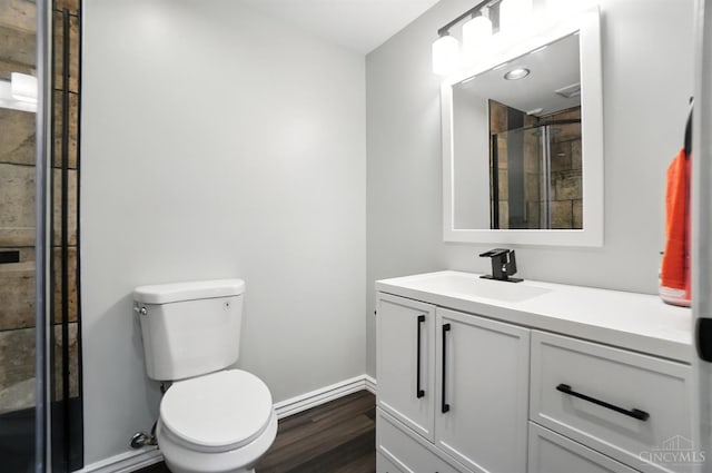 2000 Neeb Rd, Green Twp, OH 45233 - bathroom featuring vanity, wood finished floors, and a tile shower