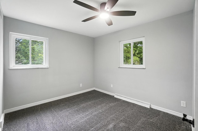 2000 Neeb Rd, Green Twp, OH 45233 - empty room featuring baseboard heating, healthy amount of natural light, a ceiling fan, and dark carpet