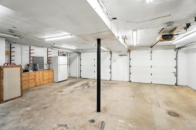 2000 Neeb Rd, Green Twp, OH 45233 - garage with freestanding refrigerator and a garage door opener